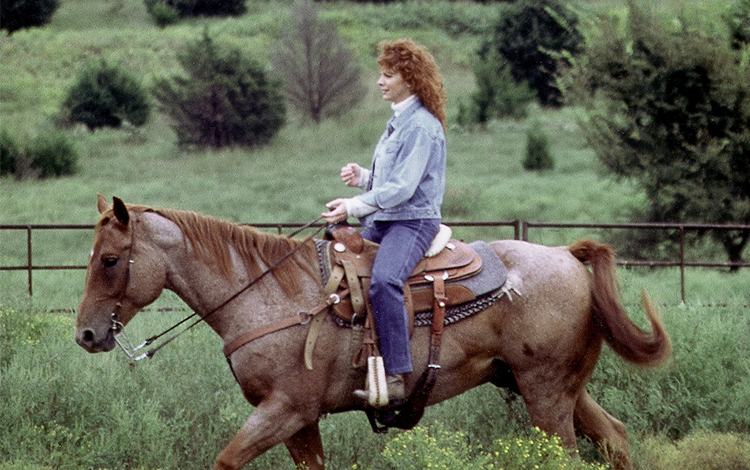 Reba on horseback